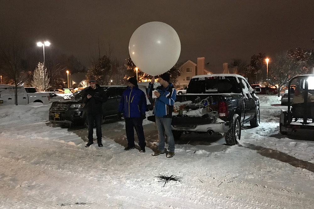Students from the University of Illinois prepare to launch a radiosonde to measure atmospheric conditions during the SNOWIE project. (Photo by Bob Rauber.)